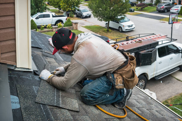 Professional Roof Replacement technician working in North Norwich, NY